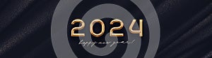 2024 new year golden logo on abstract black textile background. Greeting design with realistic gold metal number of year.