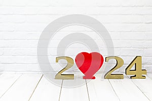 2024 new year and heart on white wood table over white background with copy space , love concept