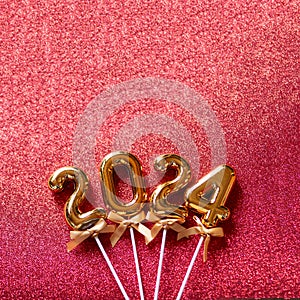 2024 New Year numbers Concept - Orange old gold numbers on red glitter background