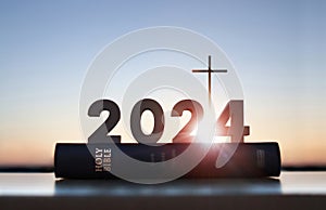 2024 New Year sunrise, Jesus\' cross, Bible book, faith, belief and church calendar background