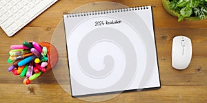 2024 resolution on blank notebook paper on white background, 2024 new year mock up, template, flat lay