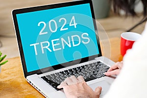 2024 trends on laptop computer screen background, business plan and technology concept