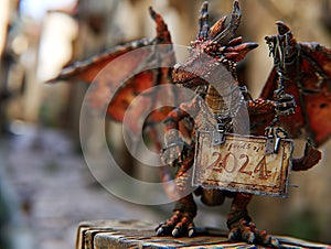 2024 is a Wood Dragon Year. Dragon holding a sign with 2024 year
