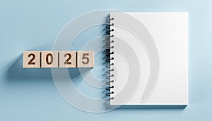 2025 mockup notepad. 2025 cubes wooden table background. New Year. plans for 2025, space for your text on notepad, mockup calendar