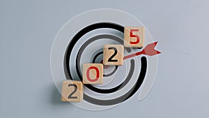 2025 Year on wooden cubes with target icon. Goal, Target, Resolution, strategy, plan, Action, mission, motivation, and New Year