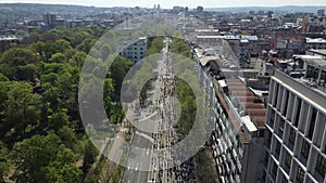 23rd of April 2023, Belgrade, Serbia. 4K footage of a group of young people running a marathon. Aerial drone photo.