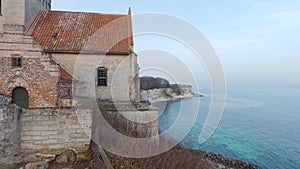 24 February 2021 Hojerup, Zealand: The old Hojerup Church stands at the top of the cliff dates from the year 1200