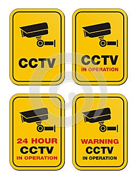 24 hour CCTV in operation - yellow signs