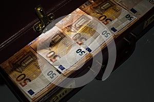 24-hour half-open briefcase full of euro banknotes