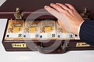 24-hour half-open briefcase full of euro banknotes