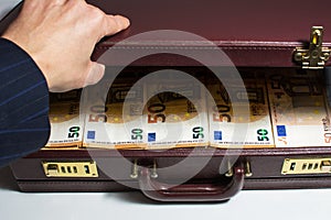 24-hour half-open briefcase full of euro banknotes