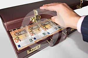 24-hour half-open briefcase full of euro banknotes