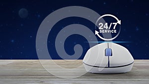 24 hours service flat icon with wireless computer mouse on wooden table over fantasy night sky and moon, Business full time servic
