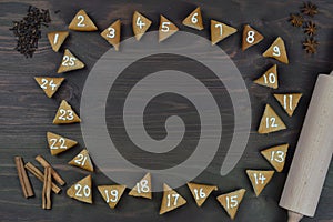 25 numbered advent cookies on brown wood