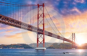 25th April Bridge in Lisbon, Portugal. Sunset sky