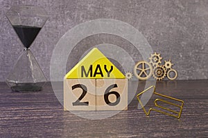 26 Mai on wooden grey cubes. Calendar cube date 26 May. Concept of date.