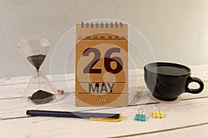 26 Mai on wooden grey cubes. Calendar cube date 26 May. Concept of date.