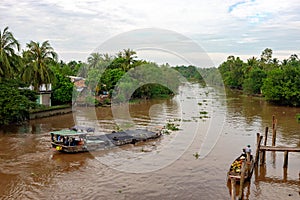 28 DECEMBER 2016, Vietnam, Tan Tru.Boat on the mekong river in south vietnam near vinh long on a sunny summer day