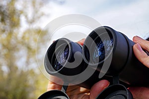 29 october 2023 Eskisehir Turkey. Woman observing bird with binoculars close up view
