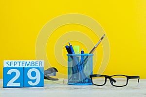 29th September. Image of september 29, calendar on yellow background with office supplies. Fall, autumn time