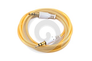 3.5 mm audio mini jack plug isolated on a white background. White audio jack with cable isolated