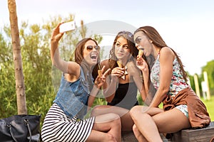 3 beautiful girlfriend eating ice cream while Selfie photo