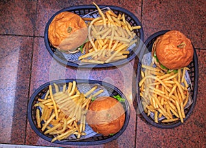 3 Burgers on the basket at burger house