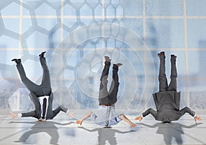 3 business people stuck upside down with transition background