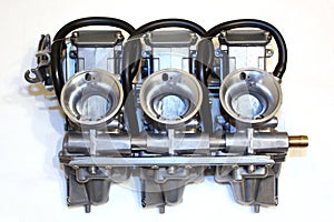 3 carburetors of a motorbike