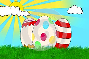 3 colorful decorated Easter eggs on a grass field