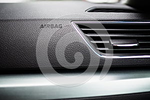 3-D Engraved Airbag Symbol Lettering Bottom Frame Left in Grainy Textured Black Dashboard with Air conditioning system