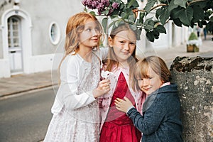 3 funny kids playing outdoors