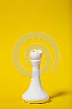 3 minutes boiled egg on a white stand on yellow background