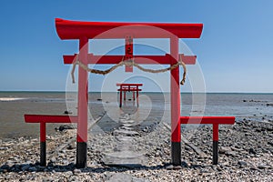 3 red torii gates and blue sky at Oouo Shrine by sea, Tara, Saga