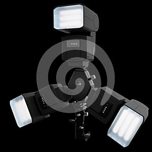 3 Speedlight flashes guns on tripod holder isolated on black