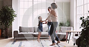 3 three age generations women family dancing in living room