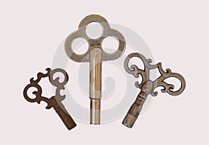 3 three skeleton antique clock keys isolated