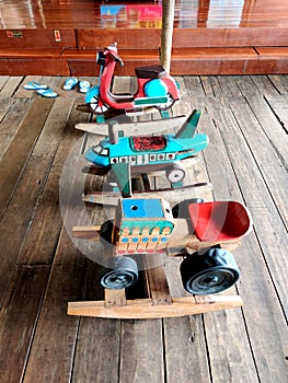3 wooden rocking horses in vehicles shapes