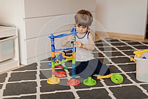 3 year old child is playing alone. Autism and misunderstandings. Concept of psychological problems