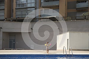 3 year old girl in a city swimming pool