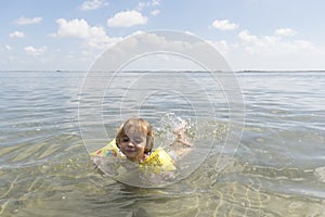 3-year-old girl swims in the Mediterranean Sea