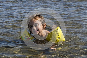 3-year-old girl swims in the Mediterranean sea