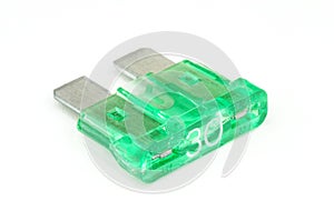 30-Amp blade fuse (green) on white