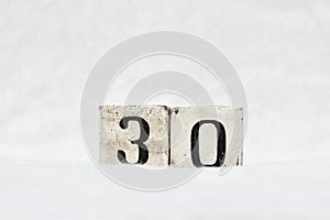 30 calendar date number, white snowy winter background copy space