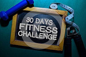 30 Days - Fitness Challenge write on a black board isolated on Office Desk