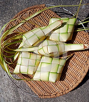 30. Ketupat Shells from Young Coconut Leaves on a Wicker Rattan Plate (30)