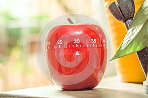 30 Minutes - Red Kitchen Egg Timer Next To A Windows And Flowerpots