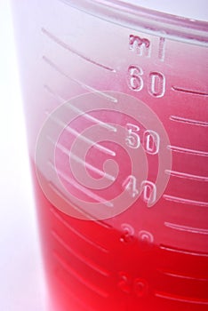 30 ml liquid as medicine in a small container