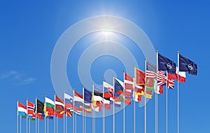 The 30 waving Flags of NATO Countries - North Atlantic Treaty. Isolated on sky background  - 3D illustration