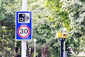 30mph camera speed limit notice with yellow camera in background